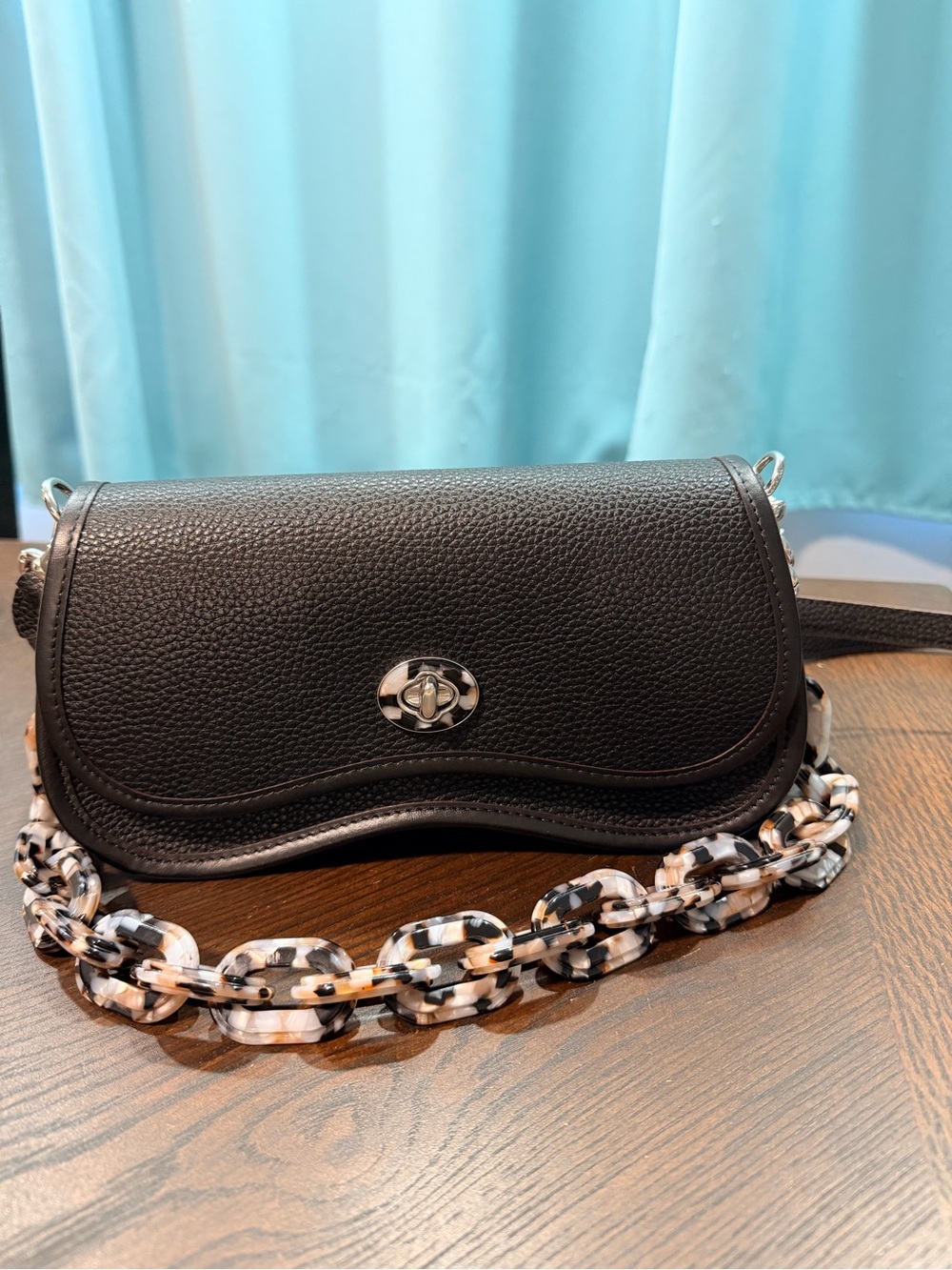 Coachtopia Wavy Dinkey black Pebble Leather Crossbody with acrylic chain.